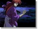 [Kenshin, in an open kamae stance, prepares for the final strike...]